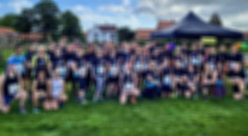 Team Caterpillar Group Photo Featured blurred out