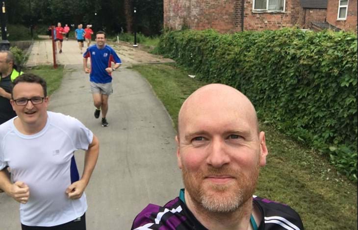 men running in workplace group