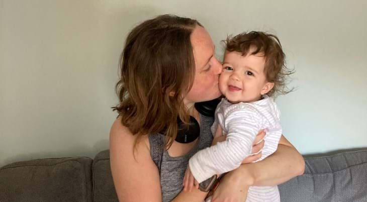 Charlie Paradise with baby at home